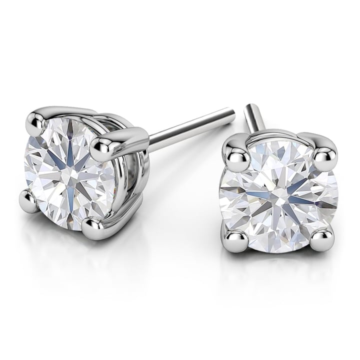 A pair of classic diamond stud earrings in white gold featuring lab-created diamonds.