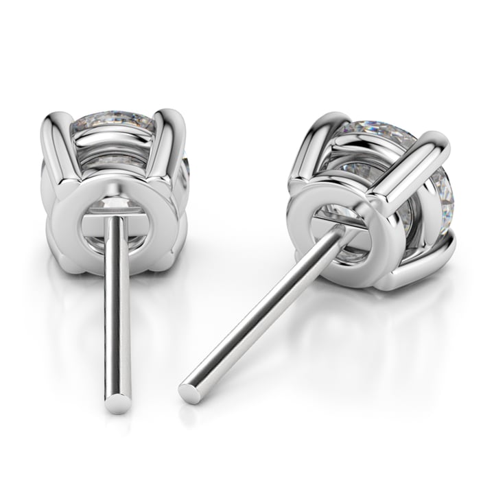 A pair of white gold earrings with diamonds