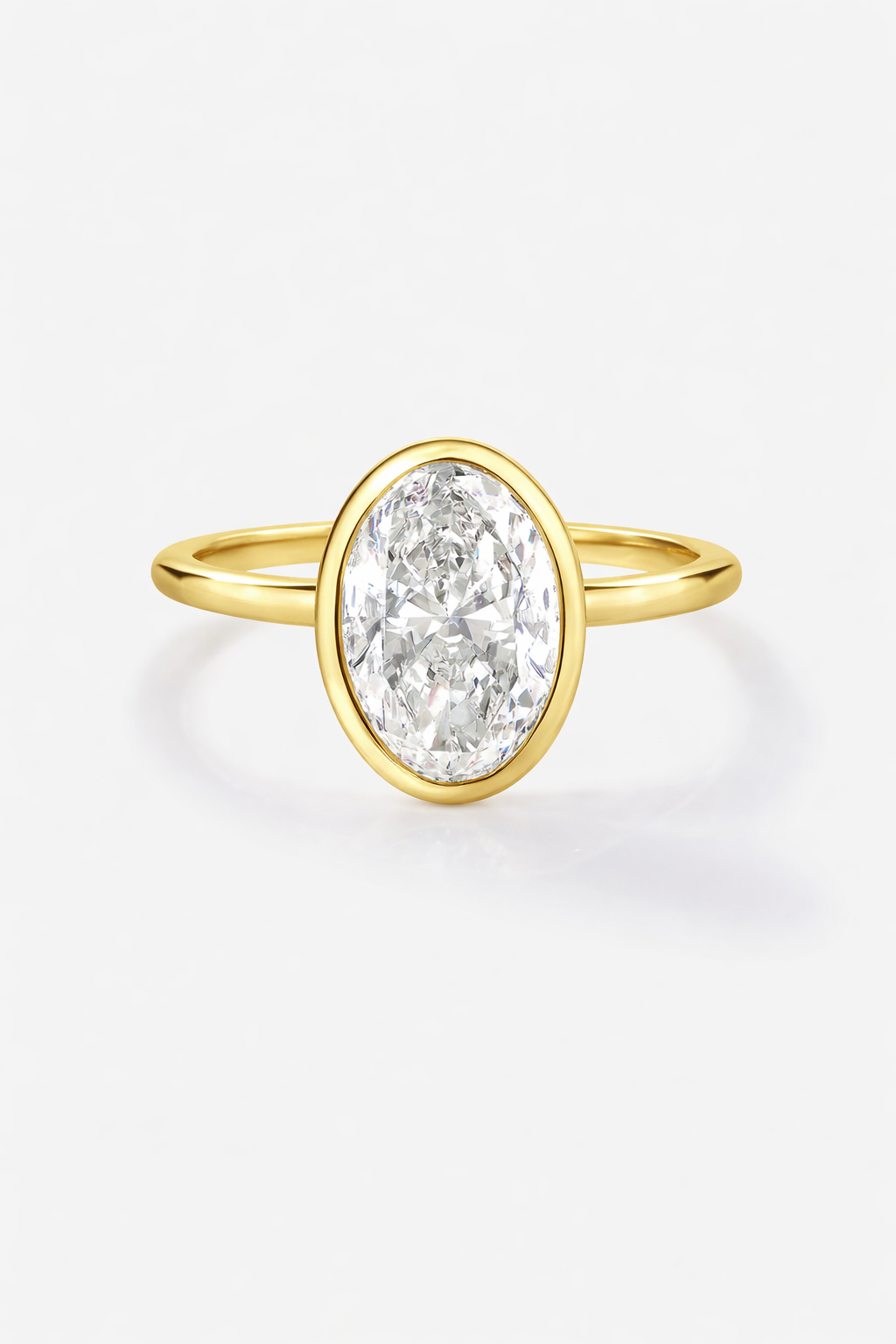 Gold ring with a large diamond on a white background