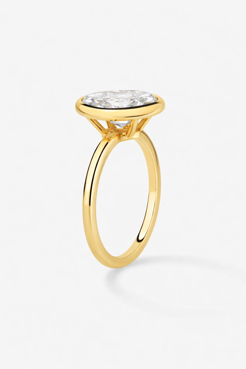 Gold ring with a diamond on a white background