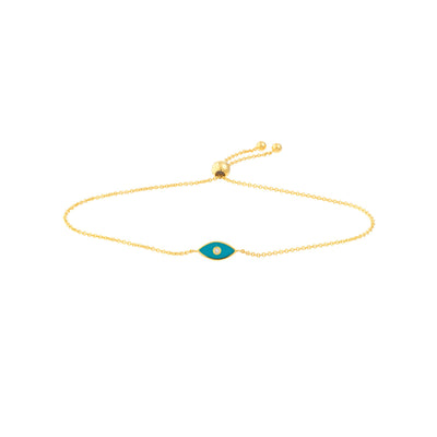 a gold bracelet with a blue eye