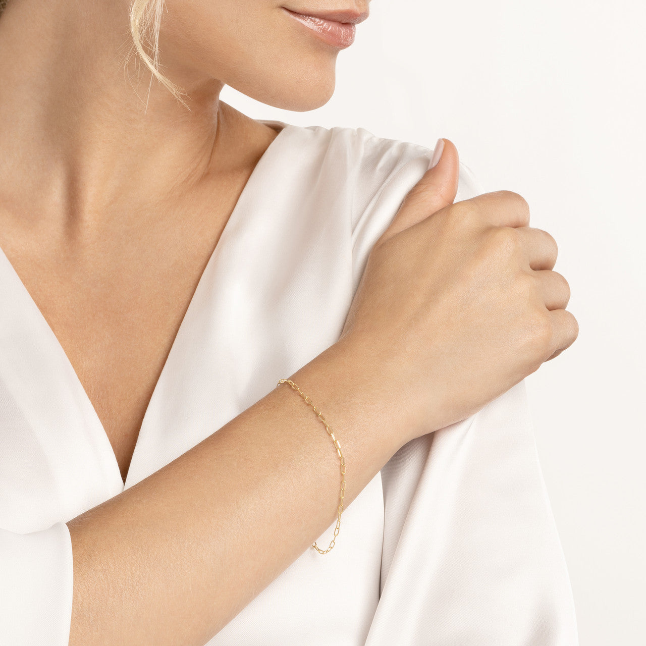 14k Yellow Gold Diamond Cut Paper Clip Bracelet on woman's hand