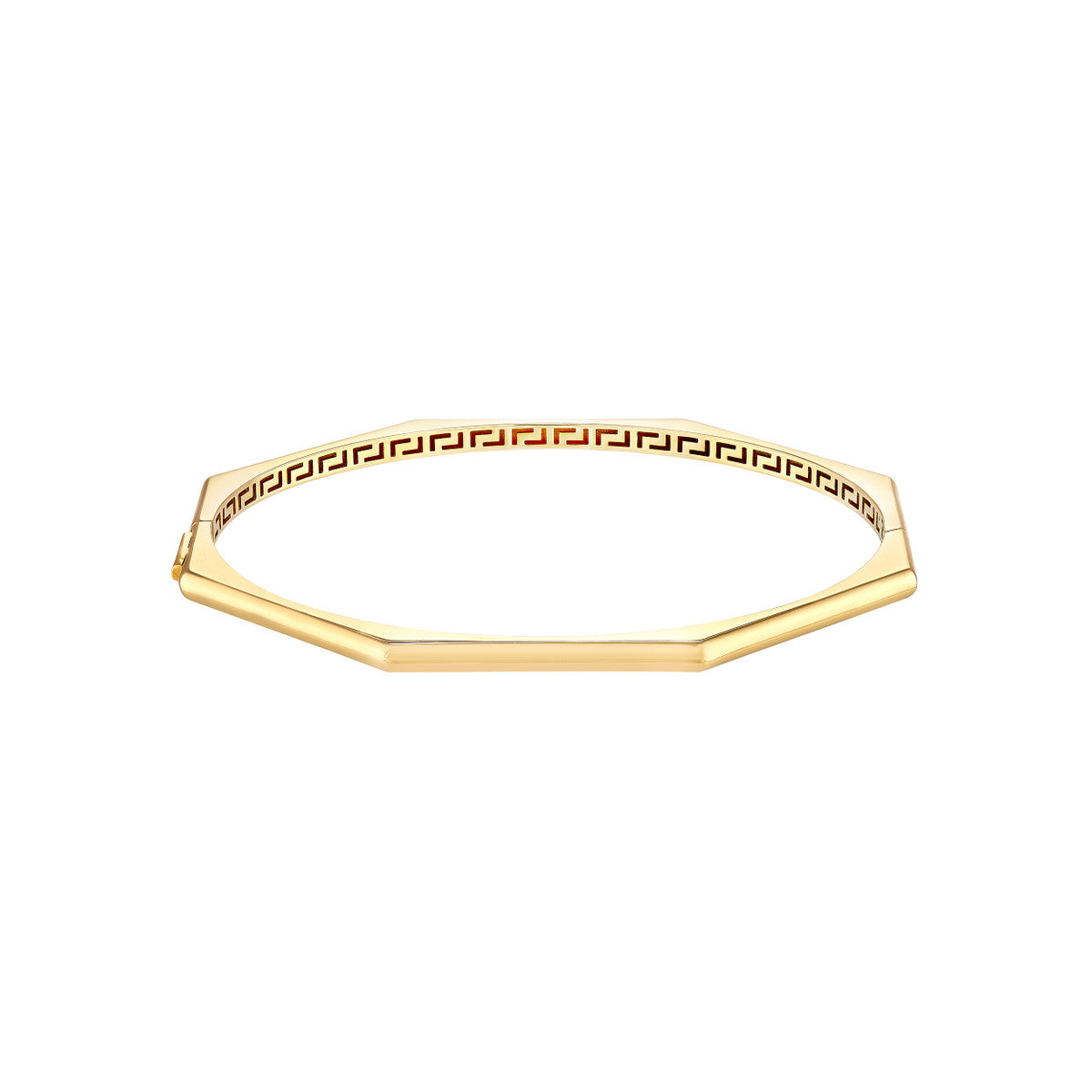 a gold bracelet with a greek key design