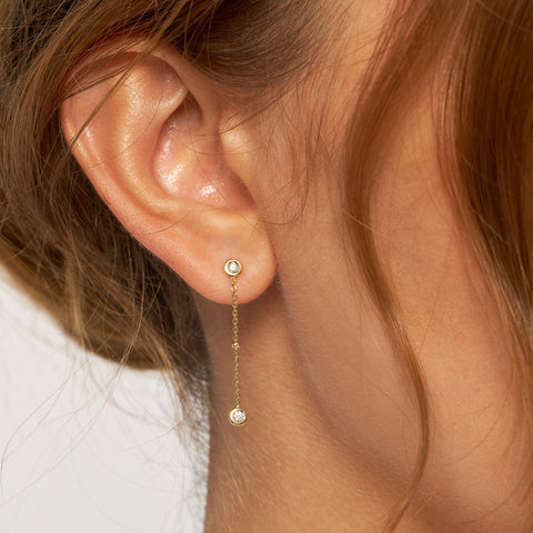14k Gold Diamond Bezel Chain Drop Earring on ear