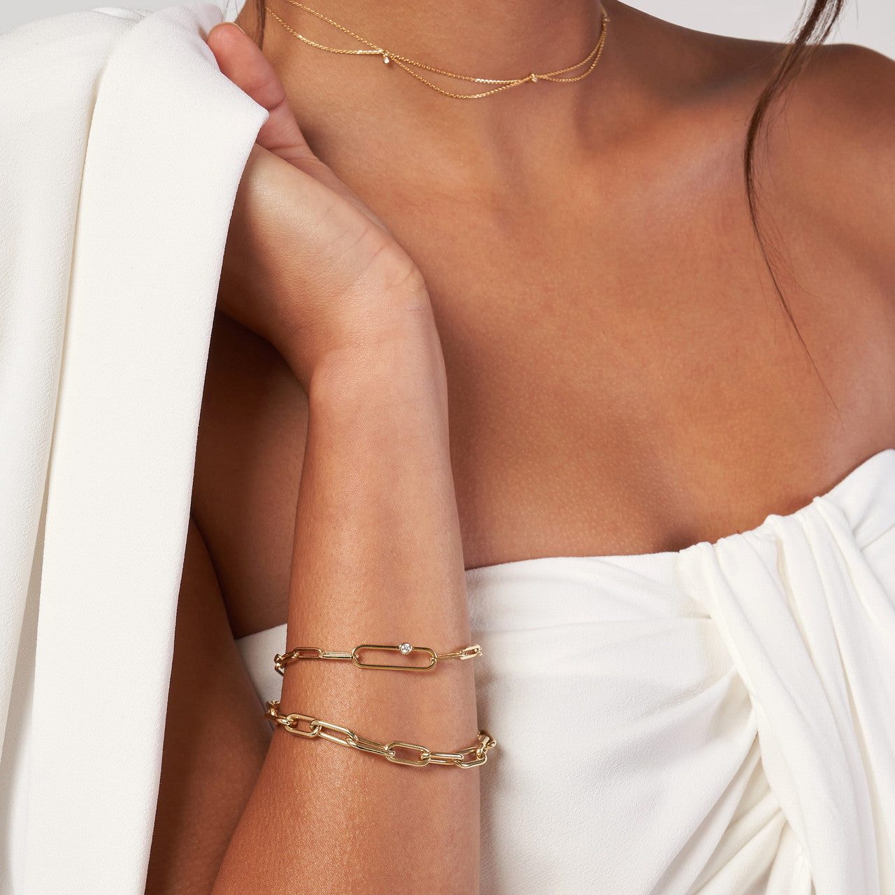 14k Yellow Gold Paper Clip Diamond Bracelet on woman's wrist