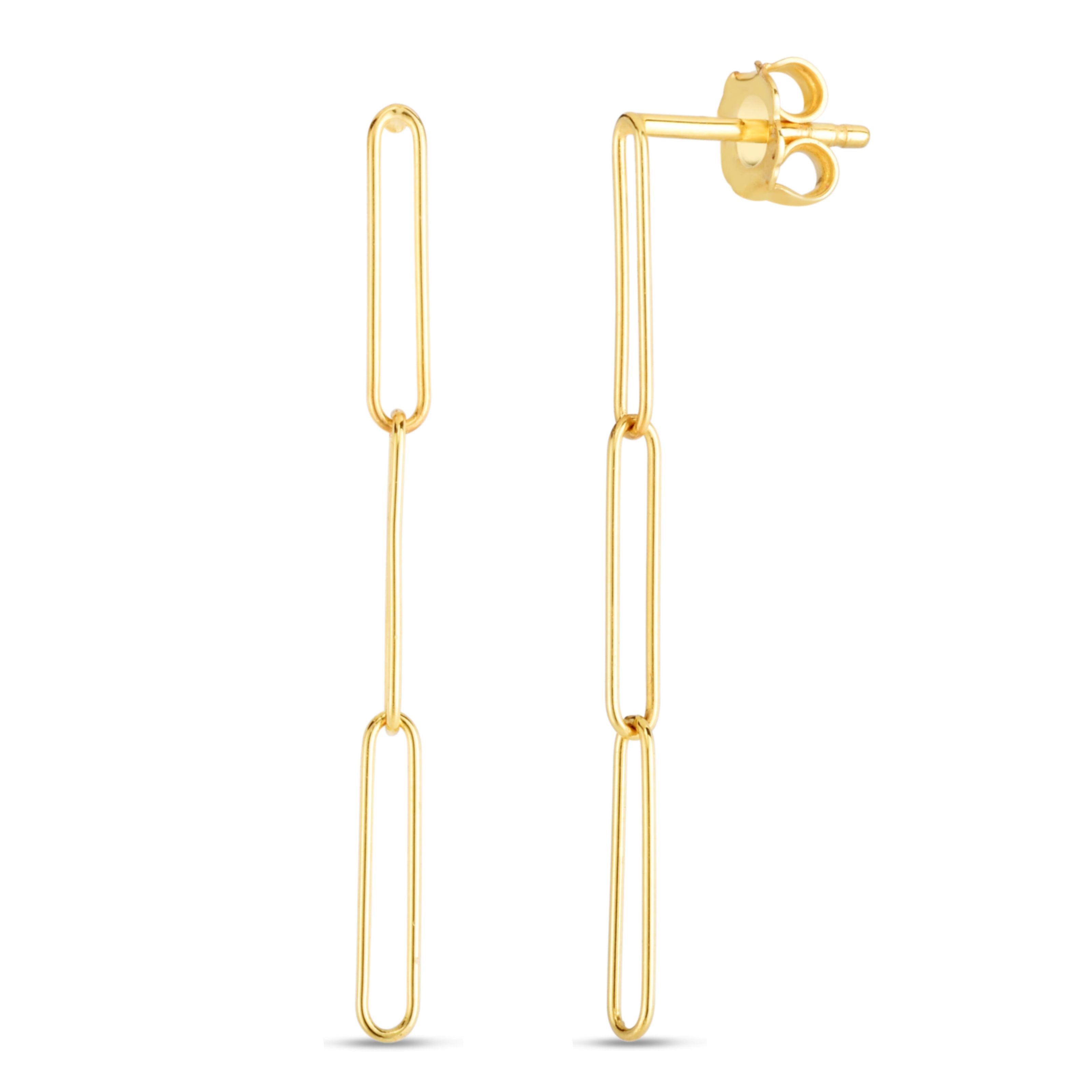 A pair of gold earrings on a white background