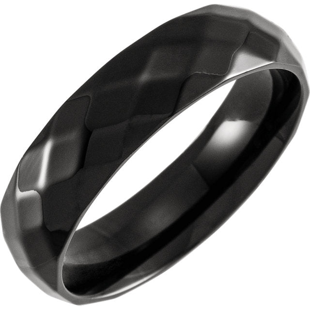 A black ring with a diamond pattern on it